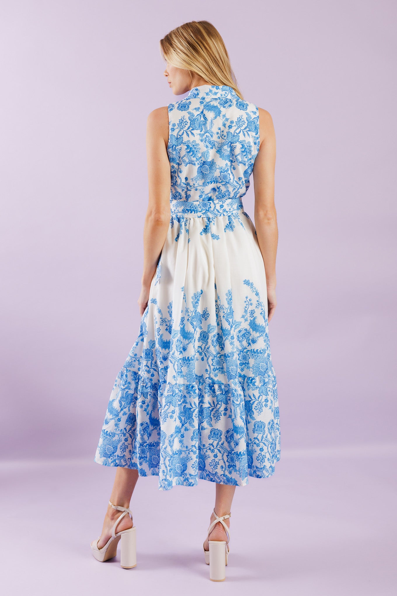 Elevate your vacation style with our Palm Shores Woven Midi Dress. This printed dress features a shirt collar, sleeveless design, and a flattering button-down front. The self belt cinches in your waist, while the full skirt with a ruffled hemline adds a touch of femininity.


Details:

Self : 100% Polyester
Lining : 100% Polyester

Size &amp; Fit

- Model is 5`8" And Wearing Size Small
- Measurements Taken From Size Small
- Approx. Length: 53" FLYING TOMATO