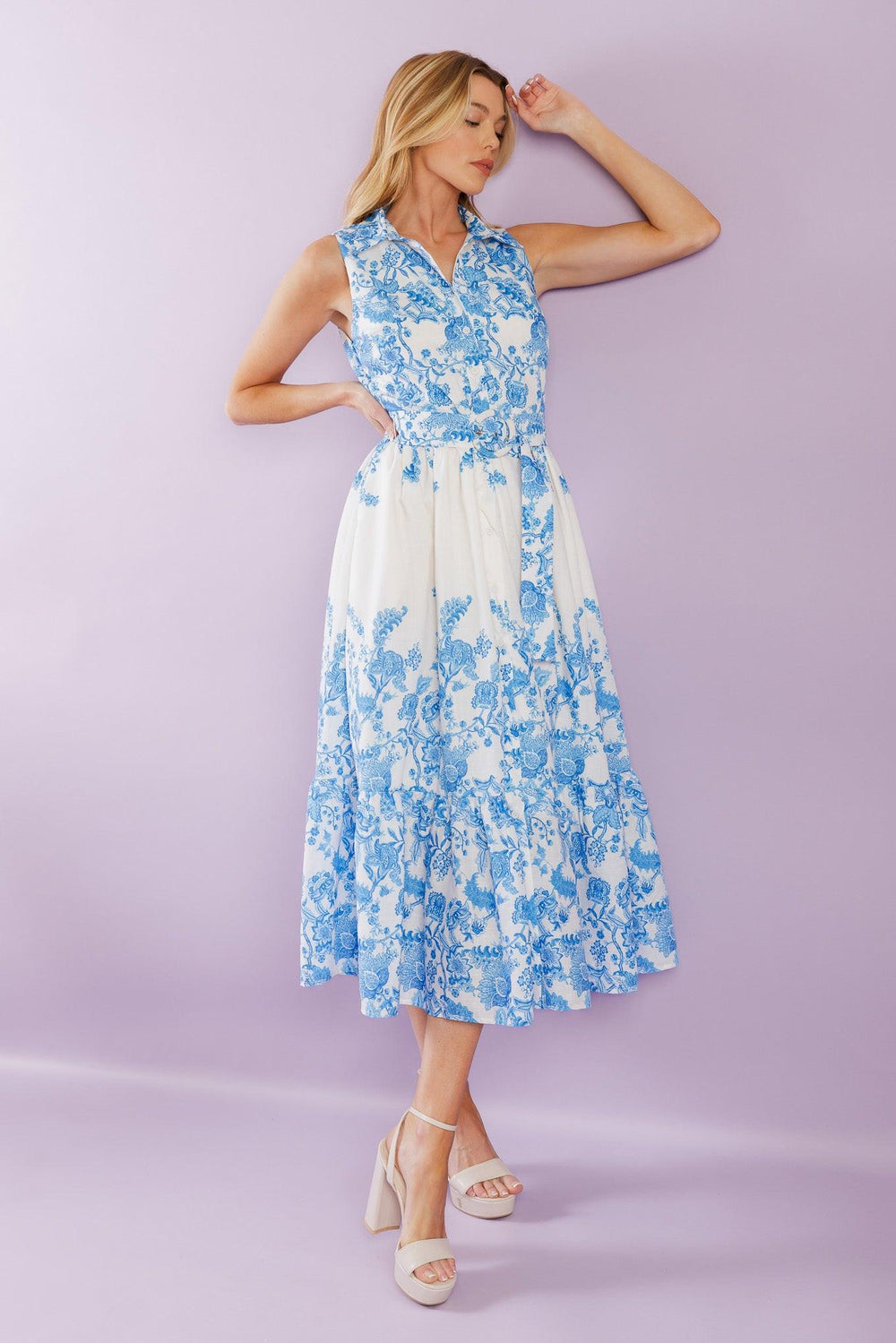 Elevate your vacation style with our Palm Shores Woven Midi Dress. This printed dress features a shirt collar, sleeveless design, and a flattering button-down front. The self belt cinches in your waist, while the full skirt with a ruffled hemline adds a touch of femininity.


Details:

Self : 100% Polyester
Lining : 100% Polyester

Size &amp; Fit

- Model is 5`8" And Wearing Size Small
- Measurements Taken From Size Small
- Approx. Length: 53" FLYING TOMATO