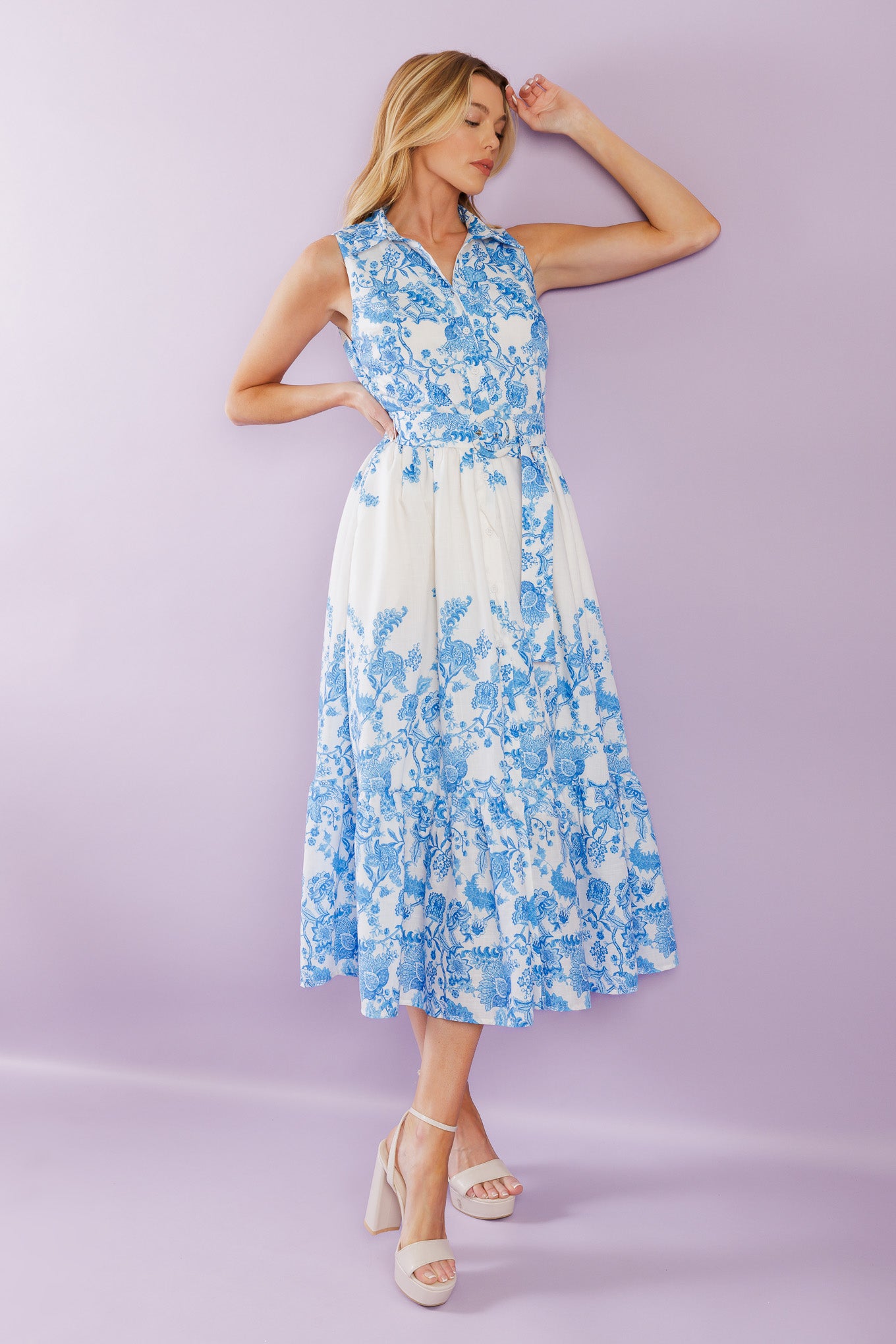 Elevate your vacation style with our Palm Shores Woven Midi Dress. This printed dress features a shirt collar, sleeveless design, and a flattering button-down front. The self belt cinches in your waist, while the full skirt with a ruffled hemline adds a touch of femininity.


Details:

Self : 100% Polyester
Lining : 100% Polyester

Size &amp; Fit

- Model is 5`8" And Wearing Size Small
- Measurements Taken From Size Small
- Approx. Length: 53" FLYING TOMATO