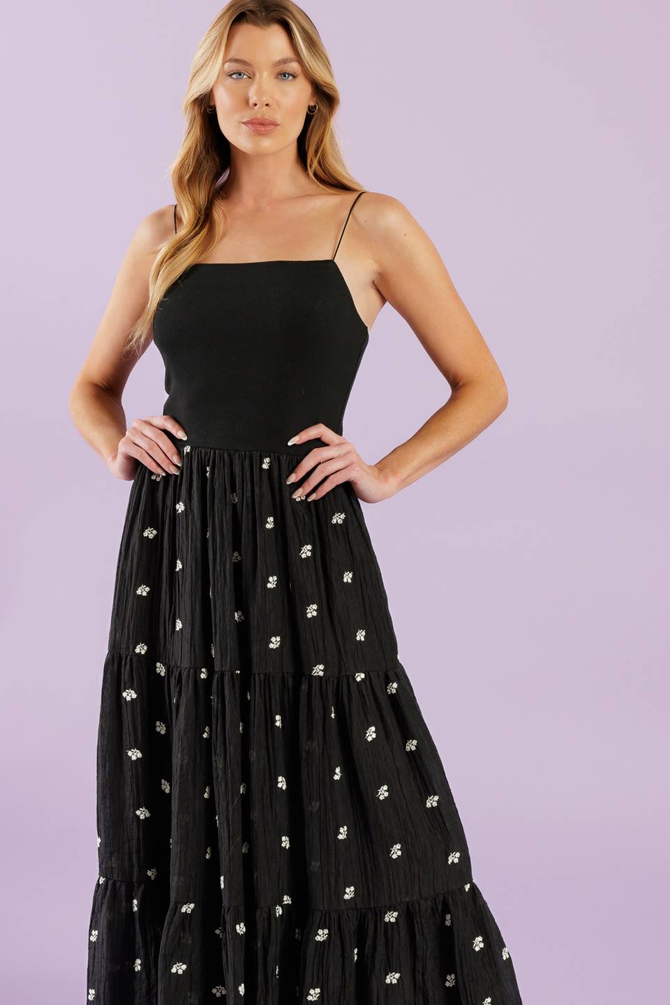 A knit and woven combination midi dress featuring knit top with straight neckline with straps, elasticized waist, &nbsp;embroidered woven skirt with ruffled hemline