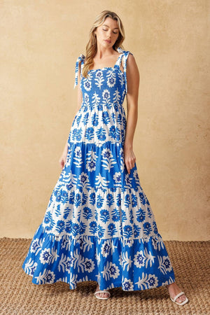 
A printed woven maxi dress featuring straight neckline, shoulder straps, smocked bodice and tiered skirt

Details:

Self : 100% Cotton
Contrast : 100% Cotton

Size &amp; Fit

- Model is 5`10" And Wearing Size Small
- Measurements Taken From Size Small
- Approx. Length: 59"