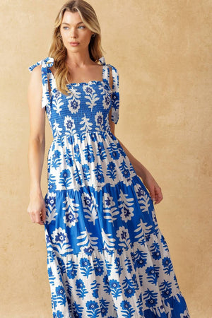 
A printed woven maxi dress featuring straight neckline, shoulder straps, smocked bodice and tiered skirt

Details:

Self : 100% Cotton
Contrast : 100% Cotton

Size &amp; Fit

- Model is 5`10" And Wearing Size Small
- Measurements Taken From Size Small
- Approx. Length: 59"