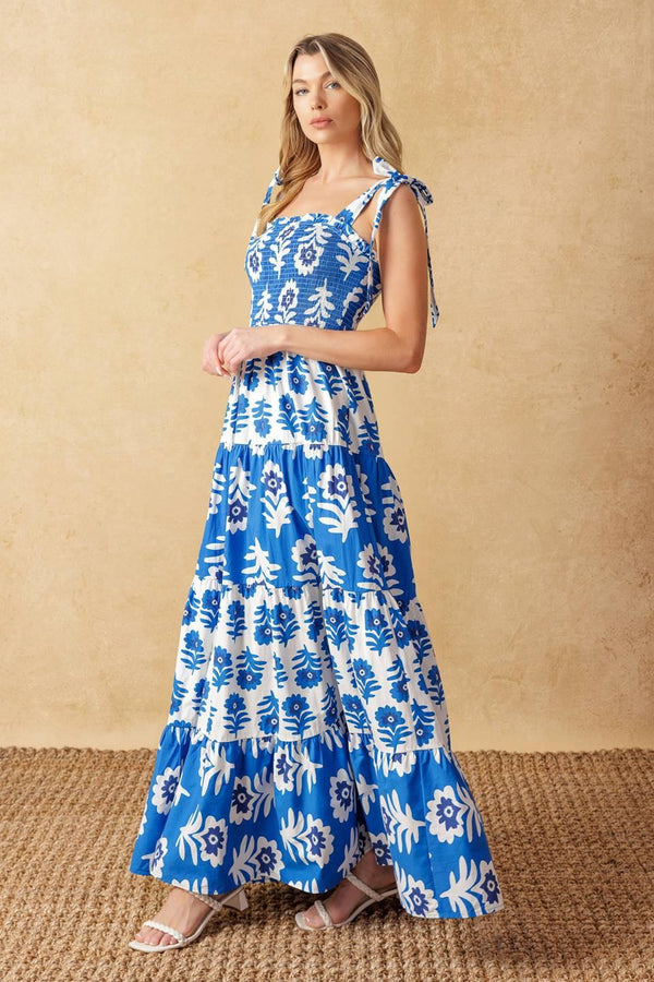
A printed woven maxi dress featuring straight neckline, shoulder straps, smocked bodice and tiered skirt

Details:

Self : 100% Cotton
Contrast : 100% Cotton

Size &amp; Fit

- Model is 5`10" And Wearing Size Small
- Measurements Taken From Size Small
- Approx. Length: 59"