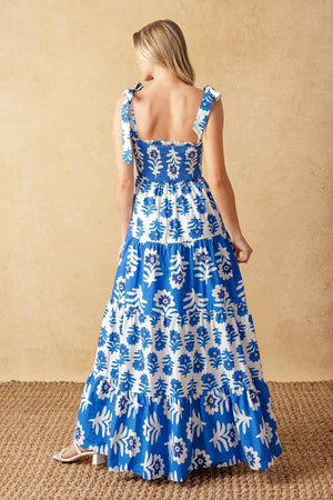 
A printed woven maxi dress featuring straight neckline, shoulder straps, smocked bodice and tiered skirt

Details:

Self : 100% Cotton
Contrast : 100% Cotton

Size &amp; Fit

- Model is 5`10" And Wearing Size Small
- Measurements Taken From Size Small
- Approx. Length: 59"