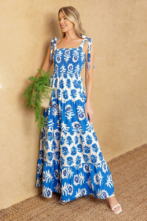 
A printed woven maxi dress featuring straight neckline, shoulder straps, smocked bodice and tiered skirt

Details:

Self : 100% Cotton
Contrast : 100% Cotton

Size &amp; Fit

- Model is 5`10" And Wearing Size Small
- Measurements Taken From Size Small
- Approx. Length: 59"