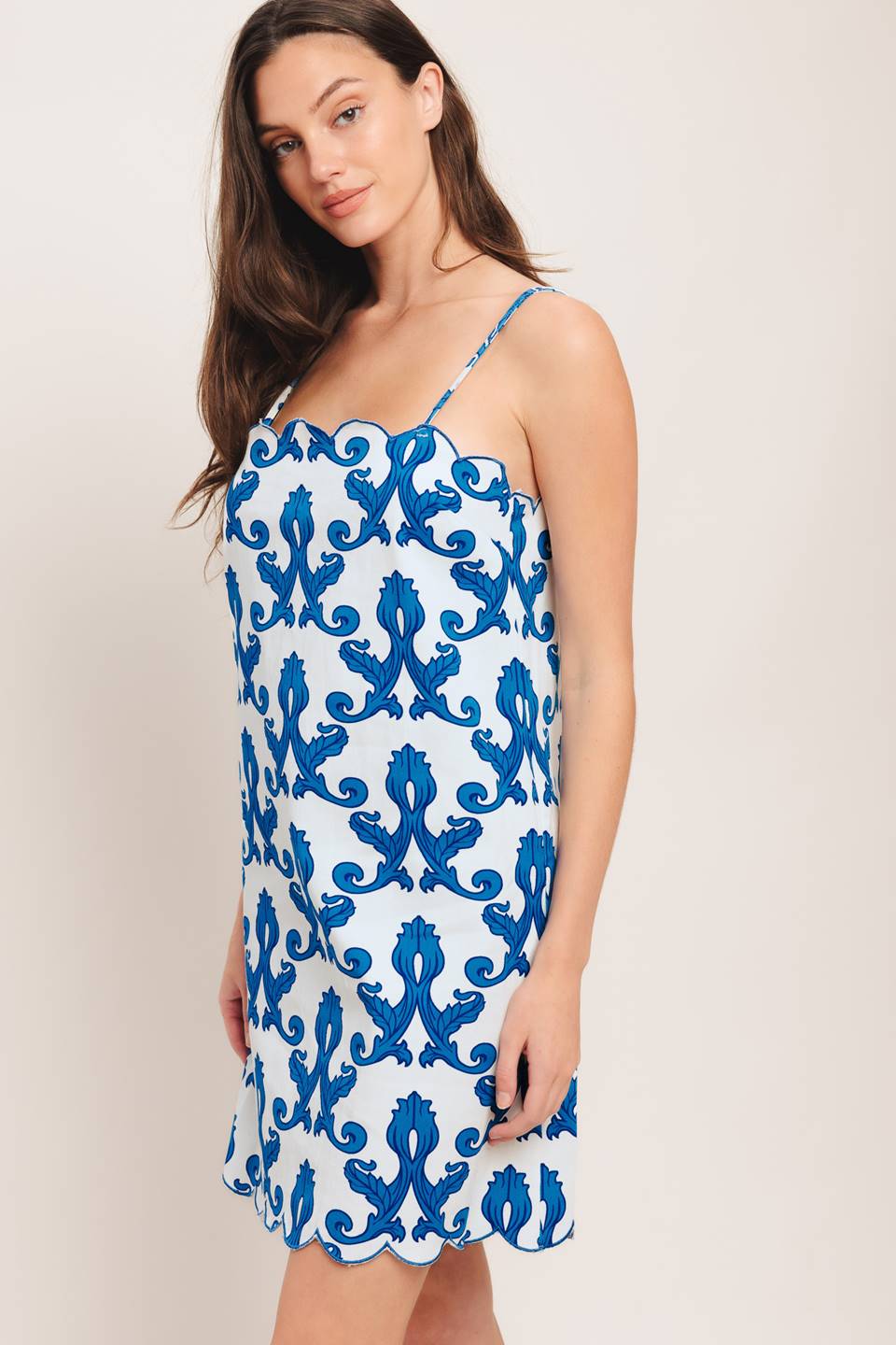 A printed woven mini dress featuring straight neckline, straps, scallop edge and back zipper closure

Details:

Self: 97% Cotton 3% Spandex

Size & Fit

-Model is 5`8" And Wearing Size Small
-Measurements Taken From Size Small
-Approx. Length: 35"