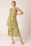 A sage green woven lace midi dress featuring round neckline, sleeveless, braided belt with tassel, cami and back button closure.