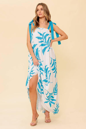 A printed woven maxi dress featuring straight neckline, shoulder tie and plunging back