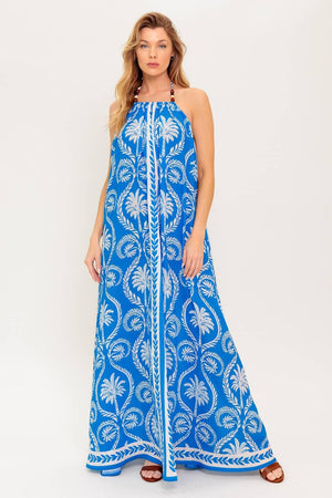 A printed woven maxi dress featuring halter neckline, trimmed tie and plunging back