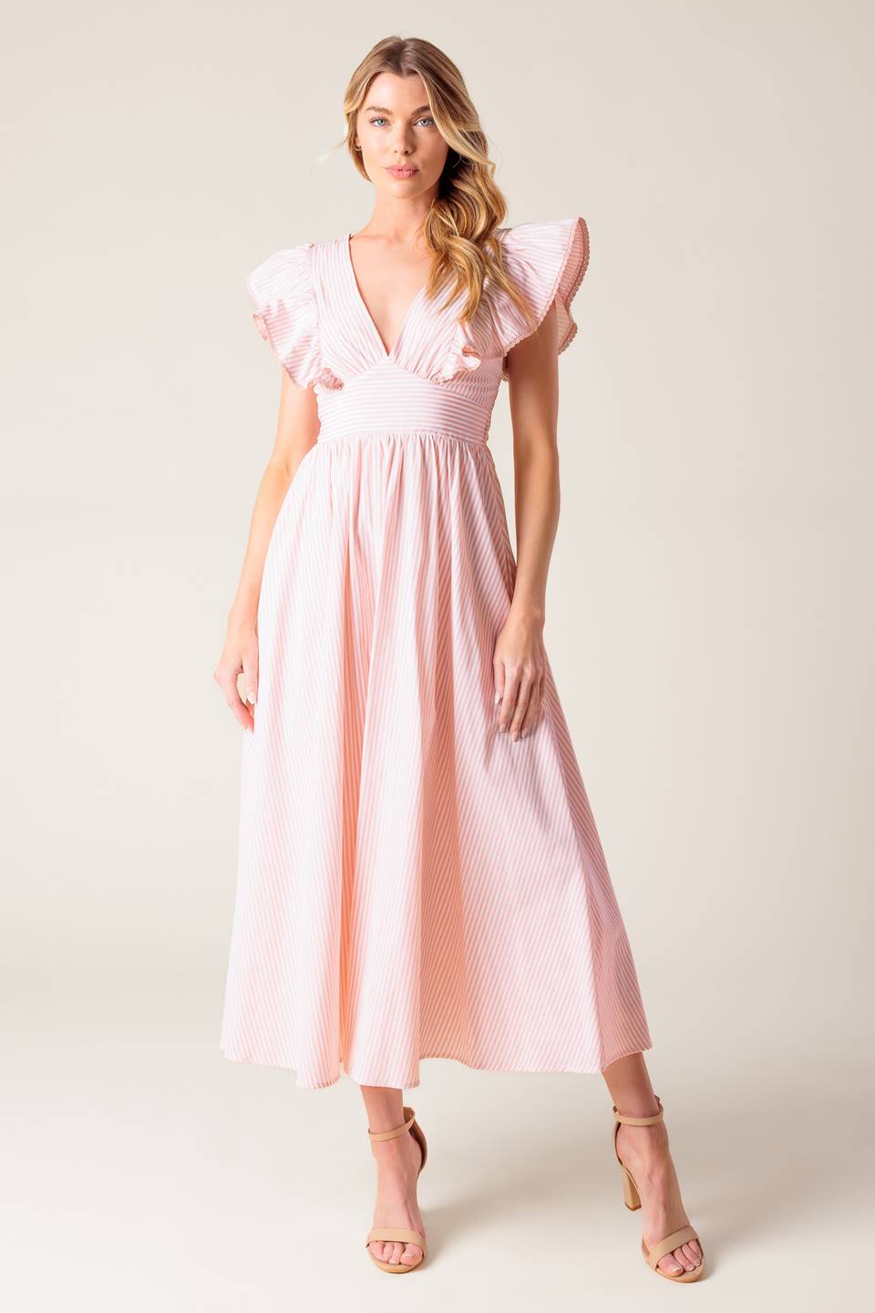 A pink and white striped woven midi dress featuring V neckline, ruffled sleeve, waist yoke, full skirt and bare back with tie detail.