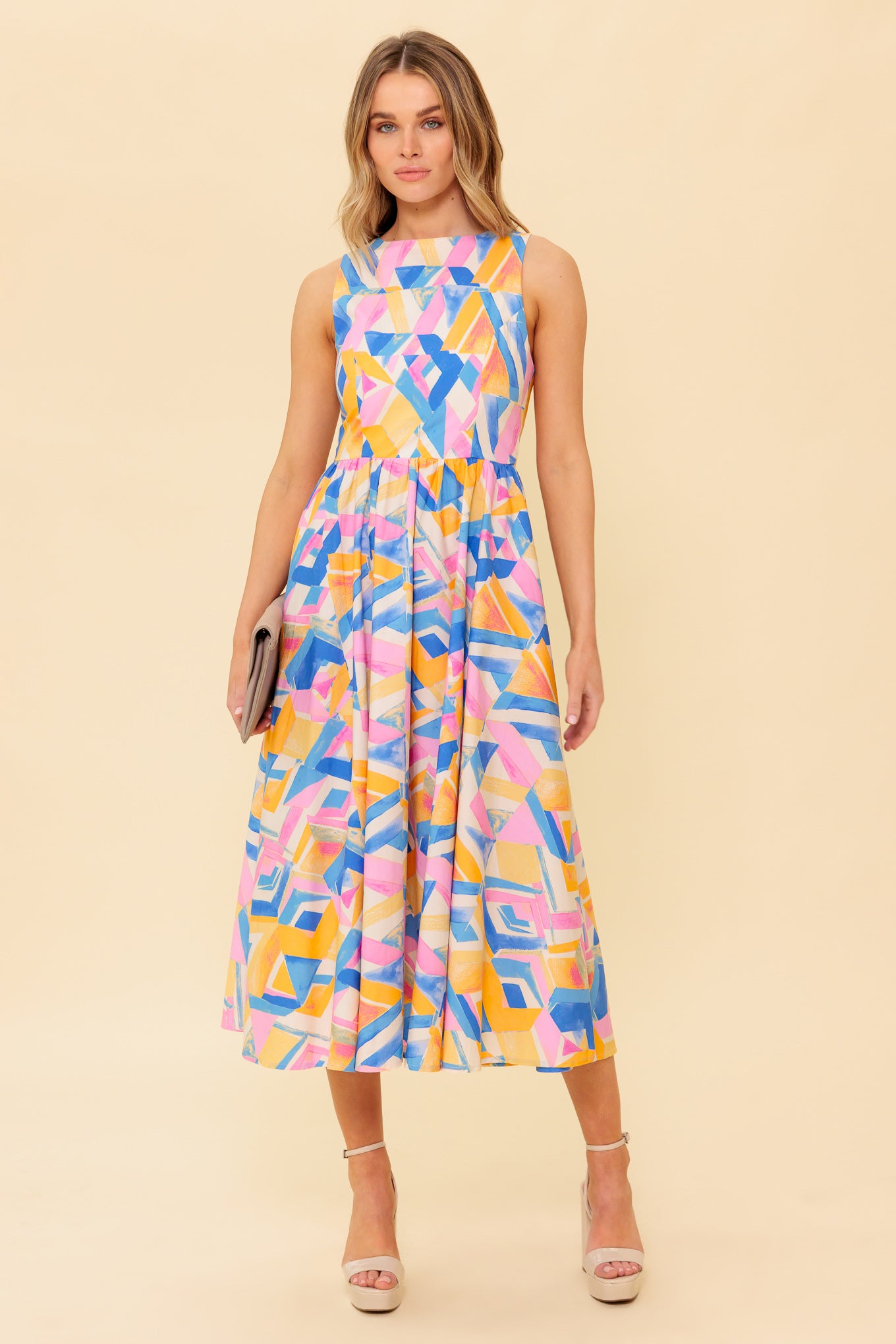 A printed woven midi dress featuring wide neckline, sleeveless, full skirt, bare back with tie and zipper closure