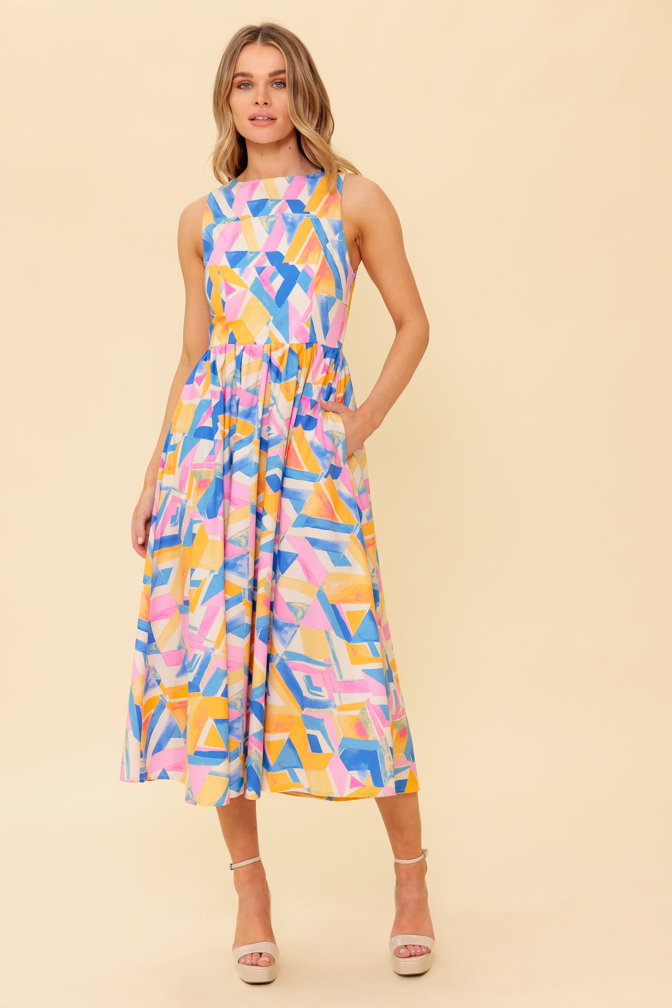 A printed woven midi dress featuring wide neckline, sleeveless, full skirt, bare back with tie and zipper closure