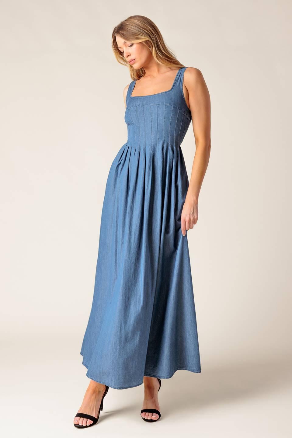 A washed lightweight denim midi dress featuring square neckline, sleeveless, pintuck bodice, full skirt and smocked back bodice
