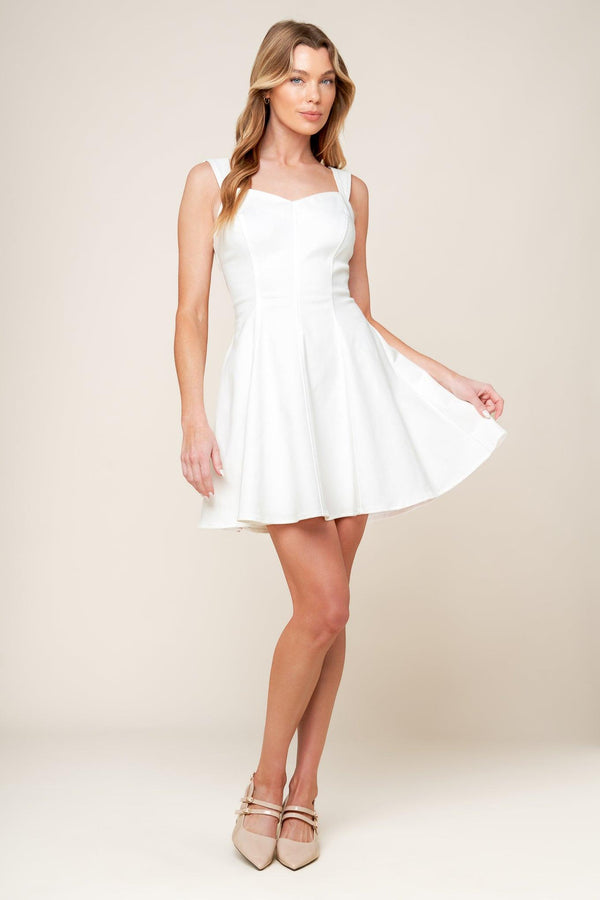 
A solid woven mini dress featuring sweetheart neckline, sleeveless, circle skirt and back zipper closure

Details:

Self : 97% Cotton 3% Spandex

Size &amp; Fit

- Model is 5`8" And Wearing Size Small
- Measurements Taken From Size Small
- Approx. Length: 33" FLYING TOMATO
