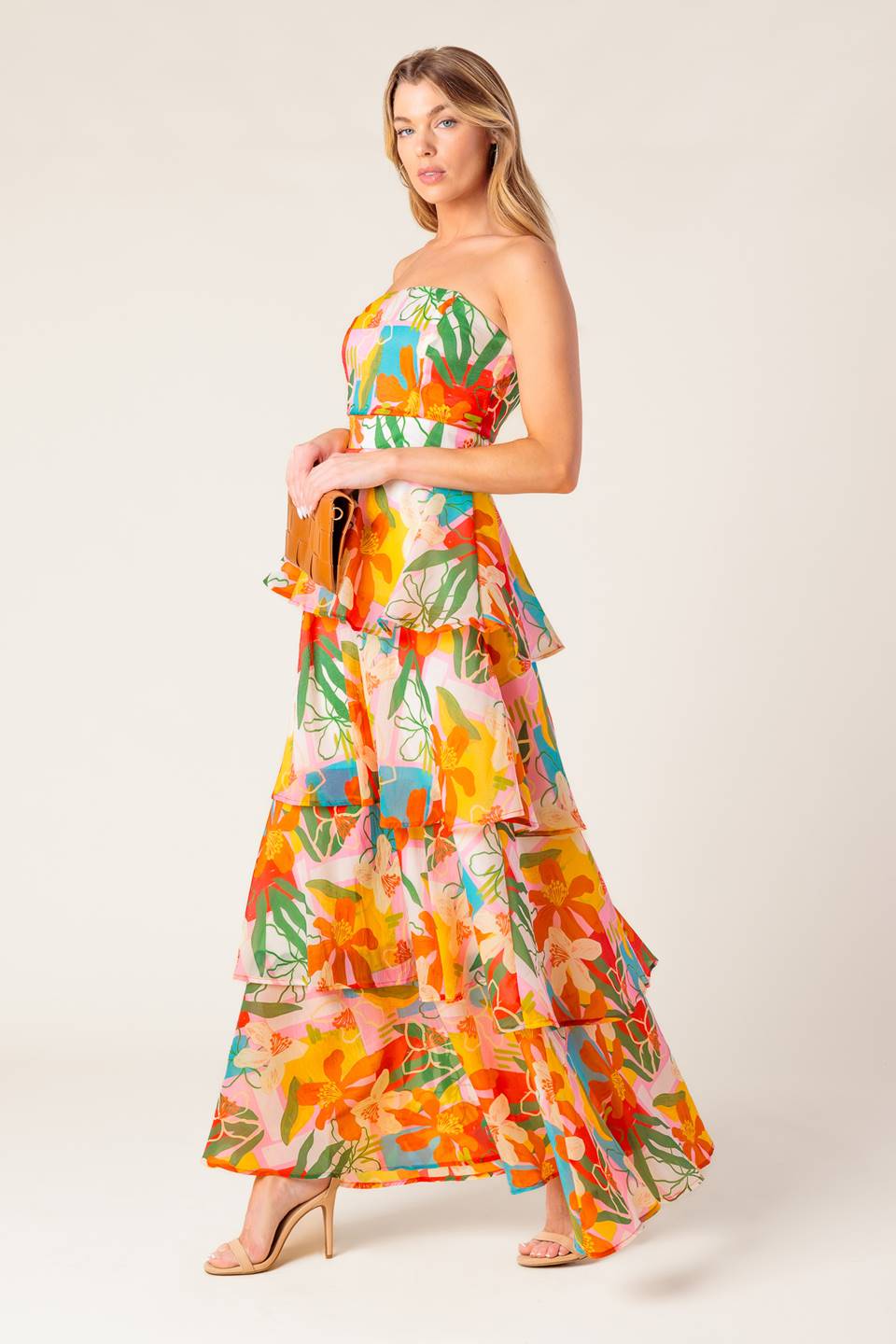 A printed woven maxi dress featuring strapless, layered skirt and back zipper closure