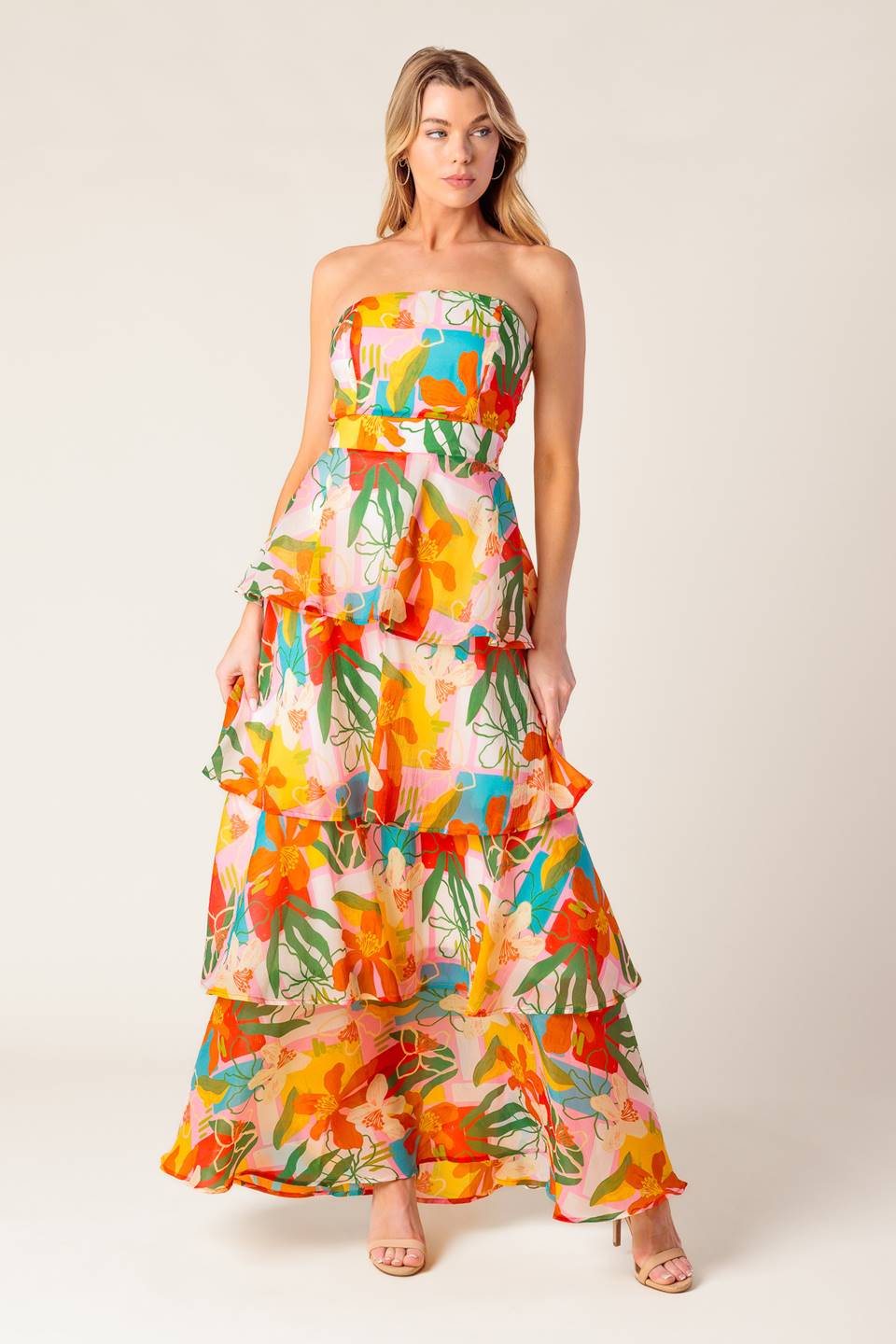 A printed woven maxi dress featuring strapless, layered skirt and back zipper closure