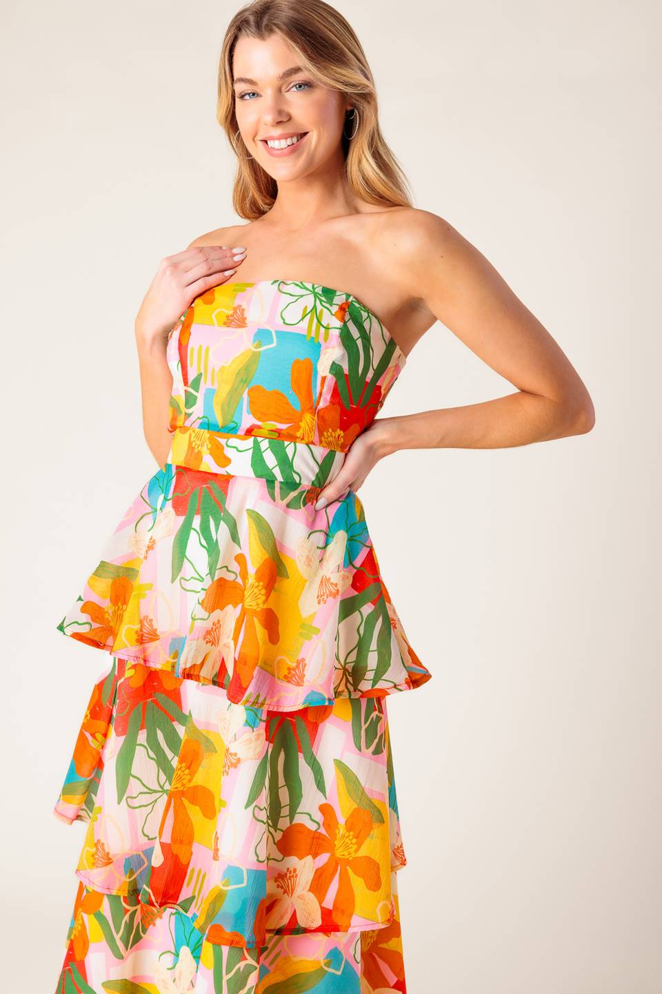 A printed woven maxi dress featuring strapless, layered skirt and back zipper closure