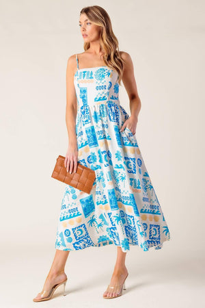 A printed woven midi dress featuring straight neckline, straps, full skirt and back zipper closure