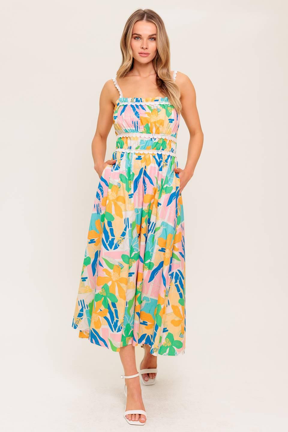 A printed woven midi dress featuring straight neckline, crochet lace strap and inset, shirred bust, full skirt and back zipper closure.