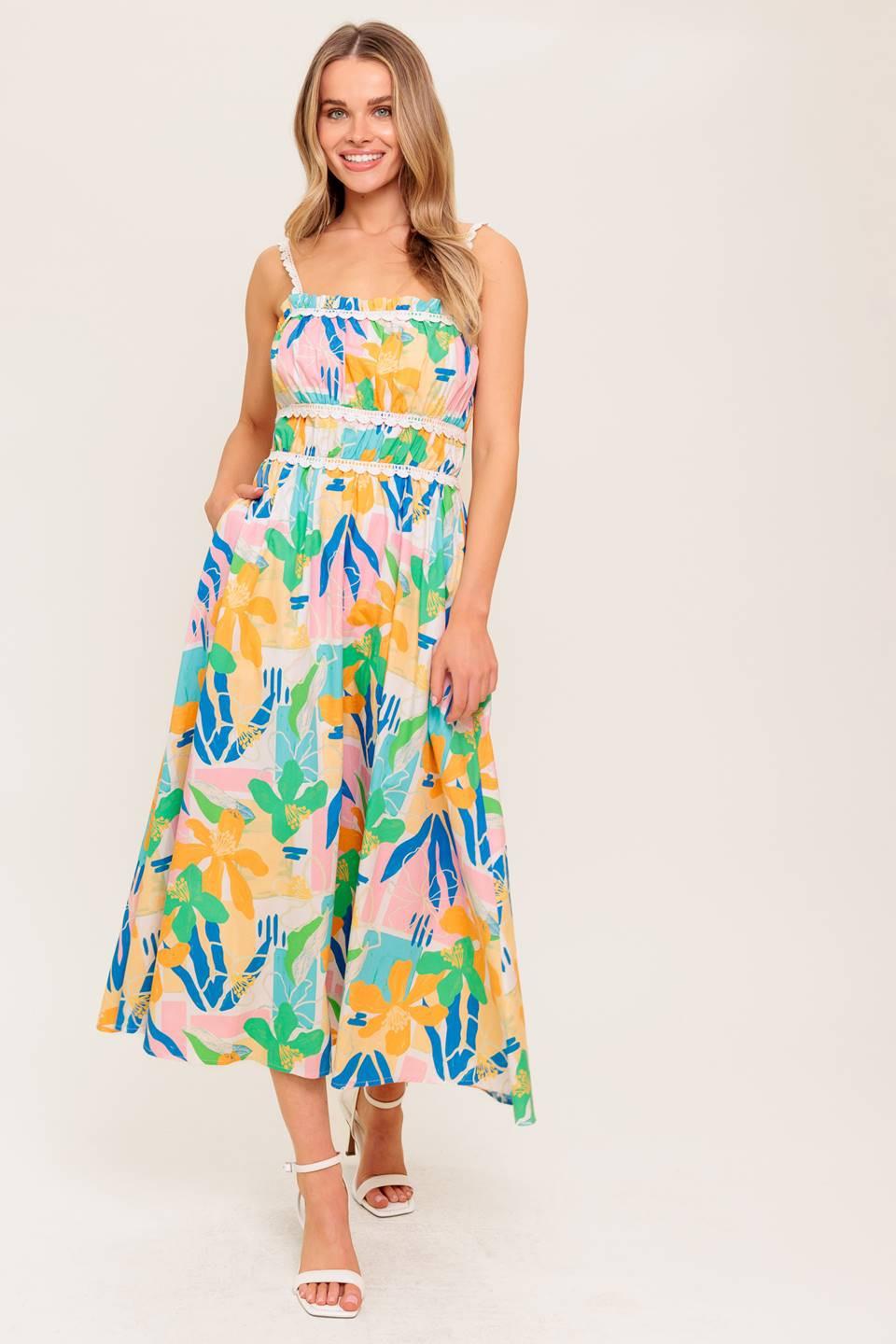 A printed woven midi dress featuring straight neckline, crochet lace strap and inset, shirred bust, full skirt and back zipper closure.