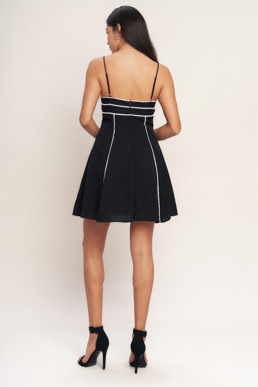 
A solid woven mini dress featuring cami top, straps, lace trim, circle skirt and back zipper closure

Details:

Self : 80% Rayon 20% Nylon
Lining : 100% Polyester Exclusive of Decoration

Size &amp; Fit

- Model is 5`8" And Wearing Size Small
- Measurements Taken From Size Small
- Approx. Length: 35" Flying Tomato
