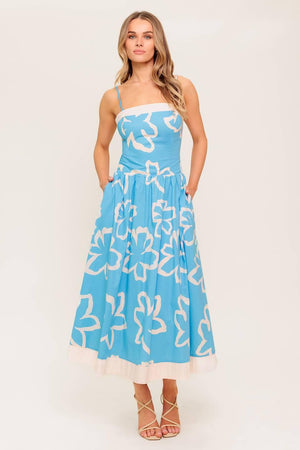 A printed woven midi dress featuring straight neckline, contrasting border and smocked back bodice.