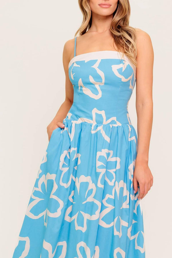 A printed woven midi dress featuring straight neckline, contrasting border and smocked back bodice.