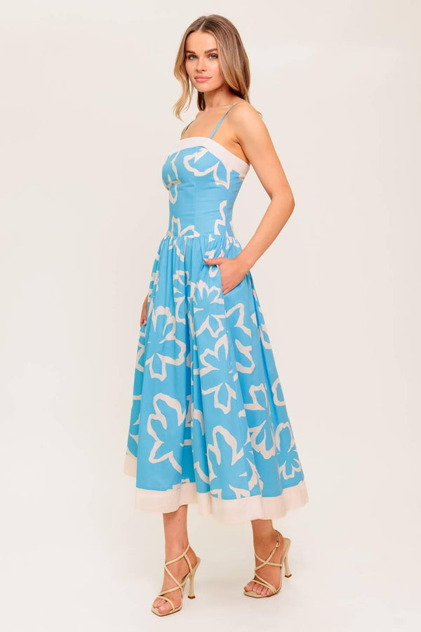 A printed woven midi dress featuring straight neckline, contrasting border and smocked back bodice.