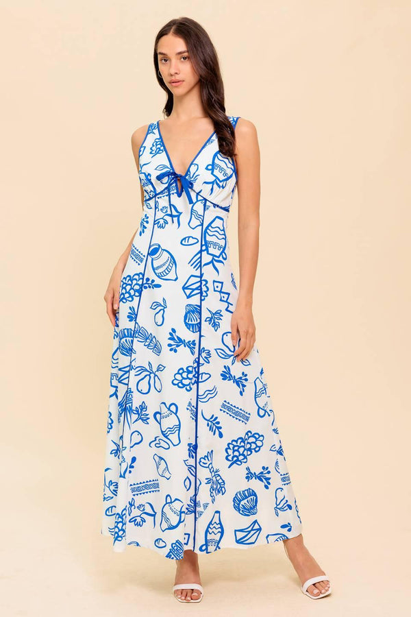 A printed woven ankle dress featuring V neckline with front bow tie, sleeveless, full skirt and plunging V back with zipper closure