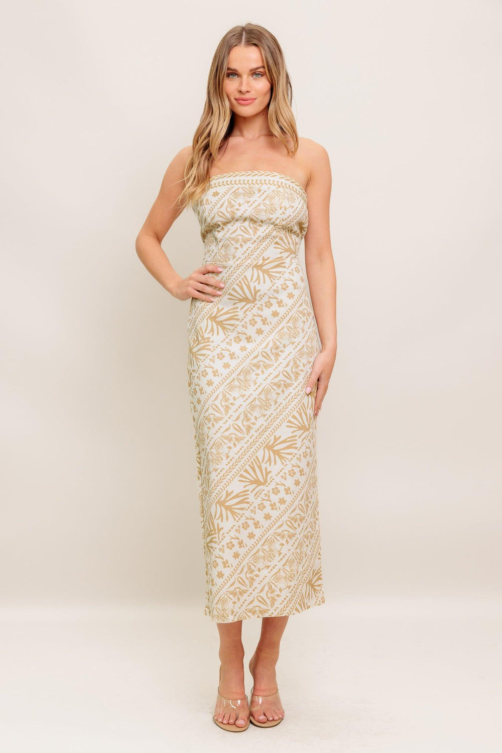 A printed woven midi dress featuring tube top, H line skirt and back zipper closure