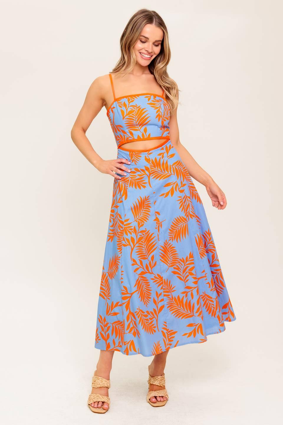 A printed woven midi dress featuring straight neckline, straps, front waist cut out, circle skirt and back zipper closure.