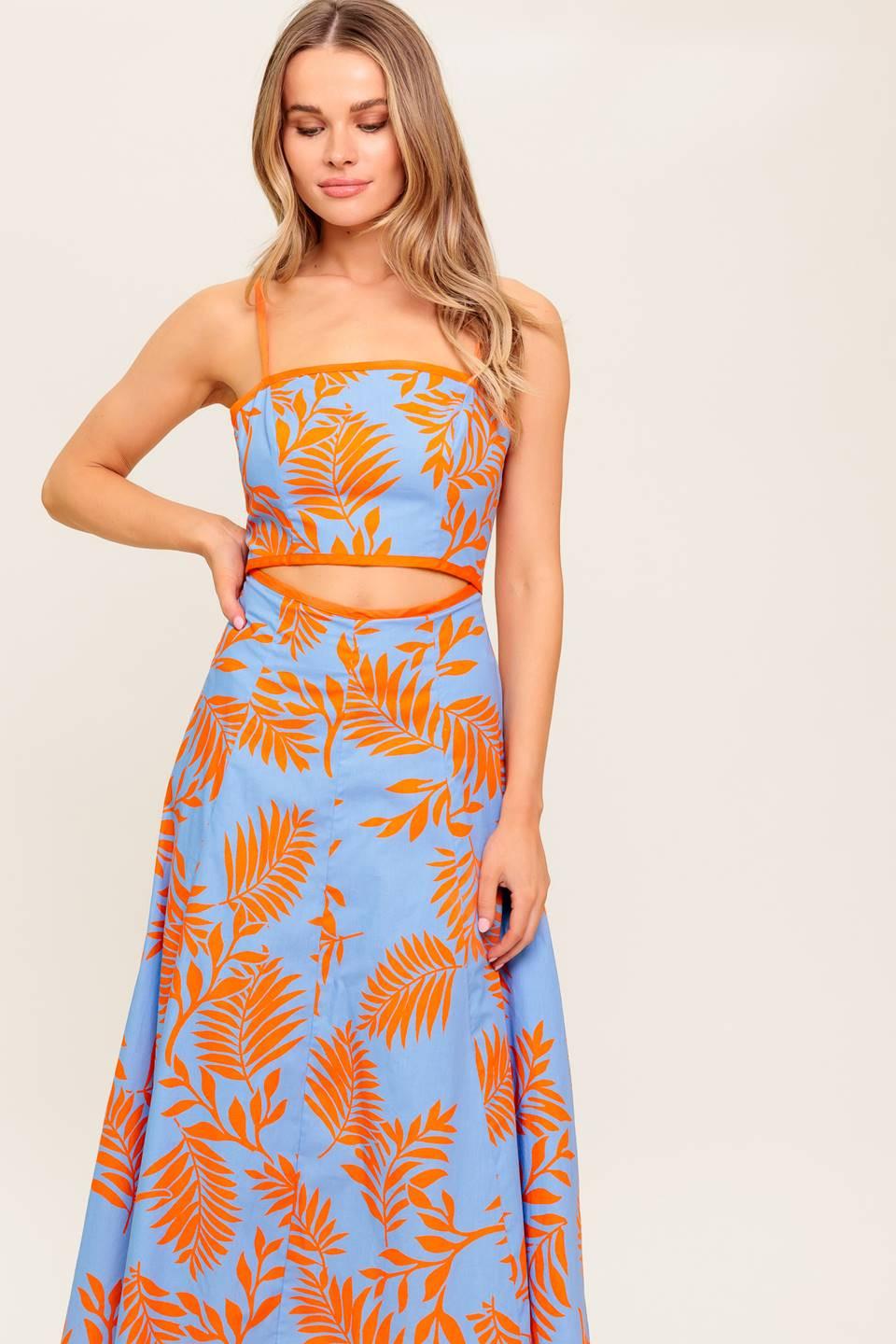 A printed woven midi dress featuring straight neckline, straps, front waist cut out, circle skirt and back zipper closure.