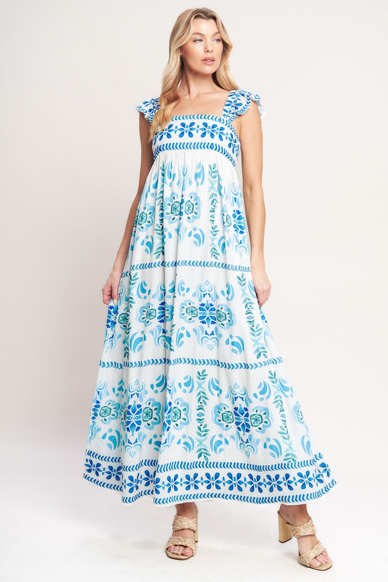 A printed woven maxi dress featuring square neckline, short flutter sleeve and smocked back bodice

Details:

Self: 100% Polyester

Lining: 100% Polyester

Size & Fit

-Model is 5`8" And Wearing Size Small
-Measurements Taken From Size Small
-Approx. Length: 56"