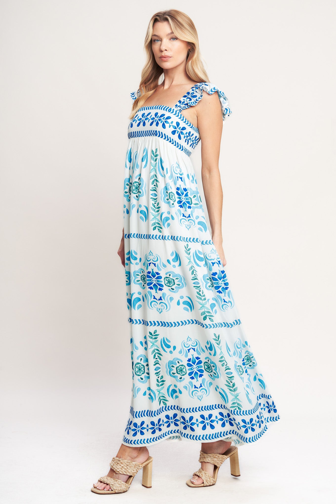 A printed woven maxi dress featuring square neckline, short flutter sleeve and smocked back bodice

Details:

Self: 100% Polyester

Lining: 100% Polyester

Size & Fit

-Model is 5`8" And Wearing Size Small
-Measurements Taken From Size Small
-Approx. Length: 56"