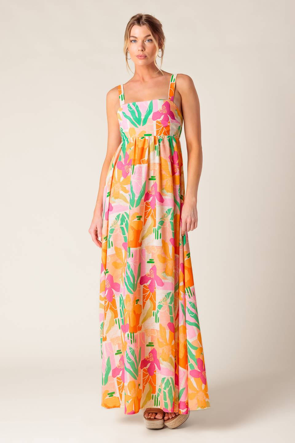 A printed woven maxi dress featuring straight neckline, straps, bare back with tie closure