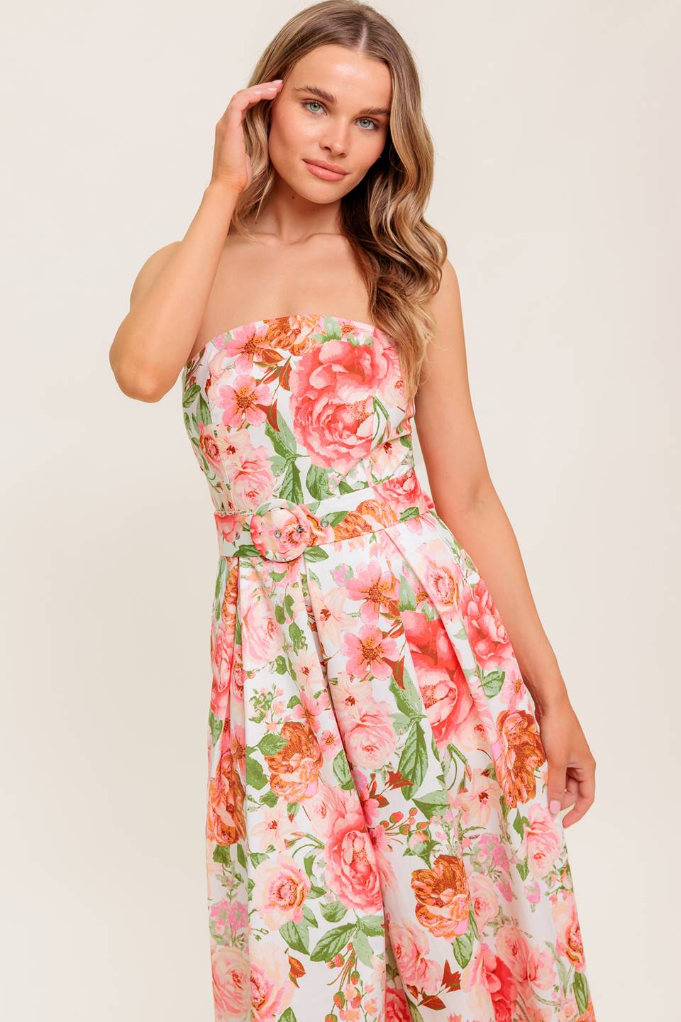 A printed woven midi dress featuring straight neckline, self belt, pleated full skirt and back zipper closure.