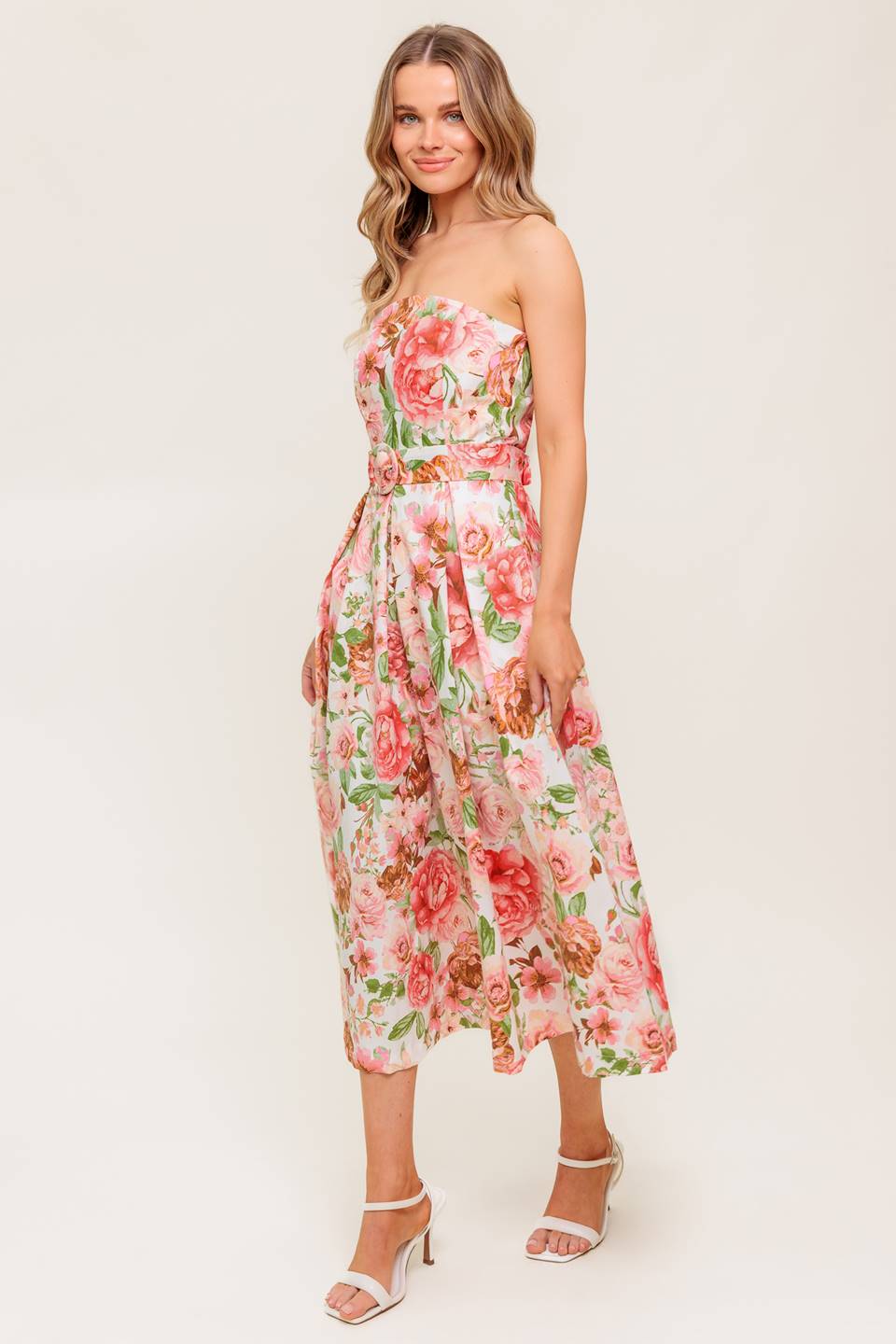 A printed woven midi dress featuring straight neckline, self belt, pleated full skirt and back zipper closure.