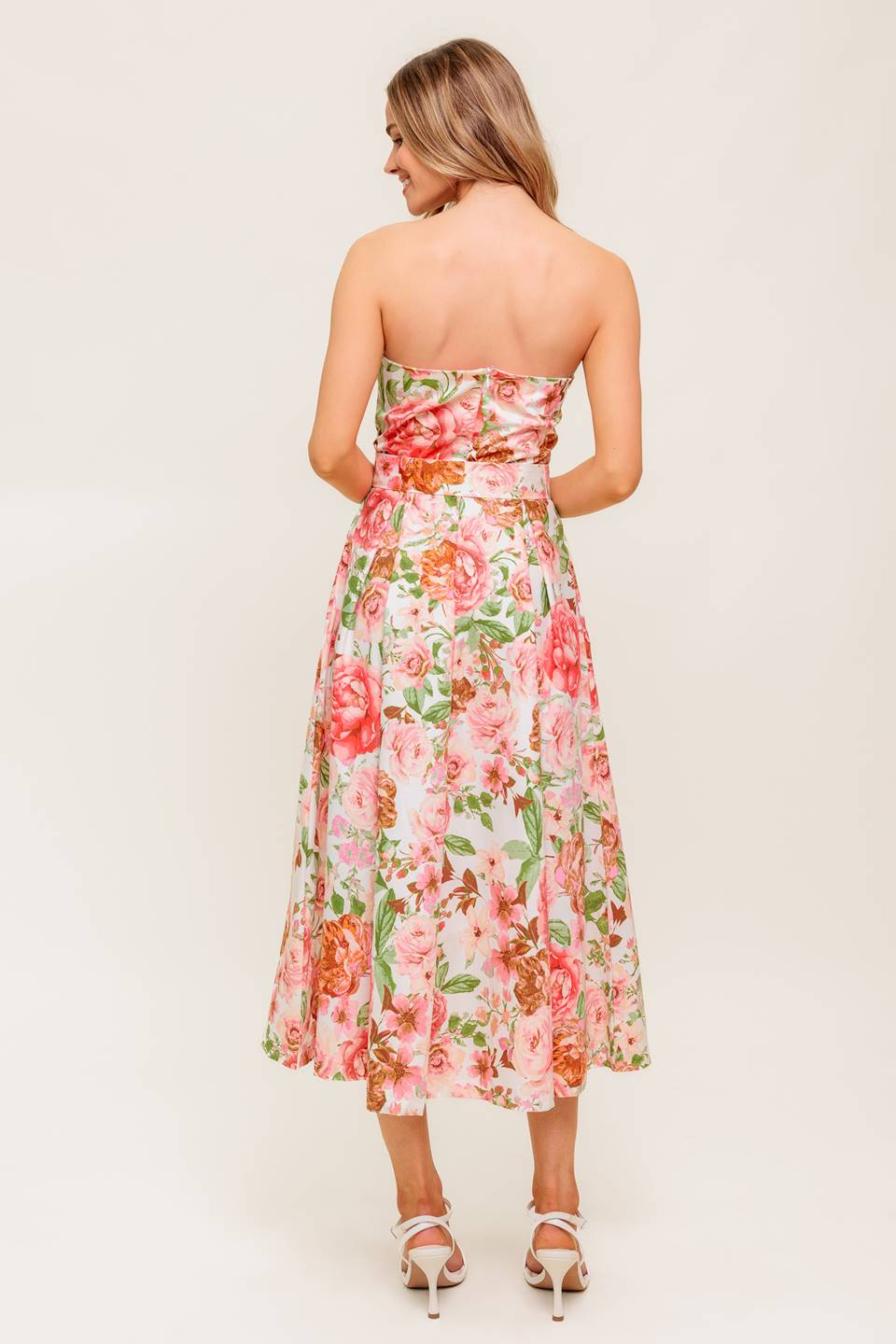 A printed woven midi dress featuring straight neckline, self belt, pleated full skirt and back zipper closure.