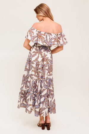 A printed woven midi dress featuring off shoulder neckline, flounce, elasticized waist with self sash tie and tiered skirt.