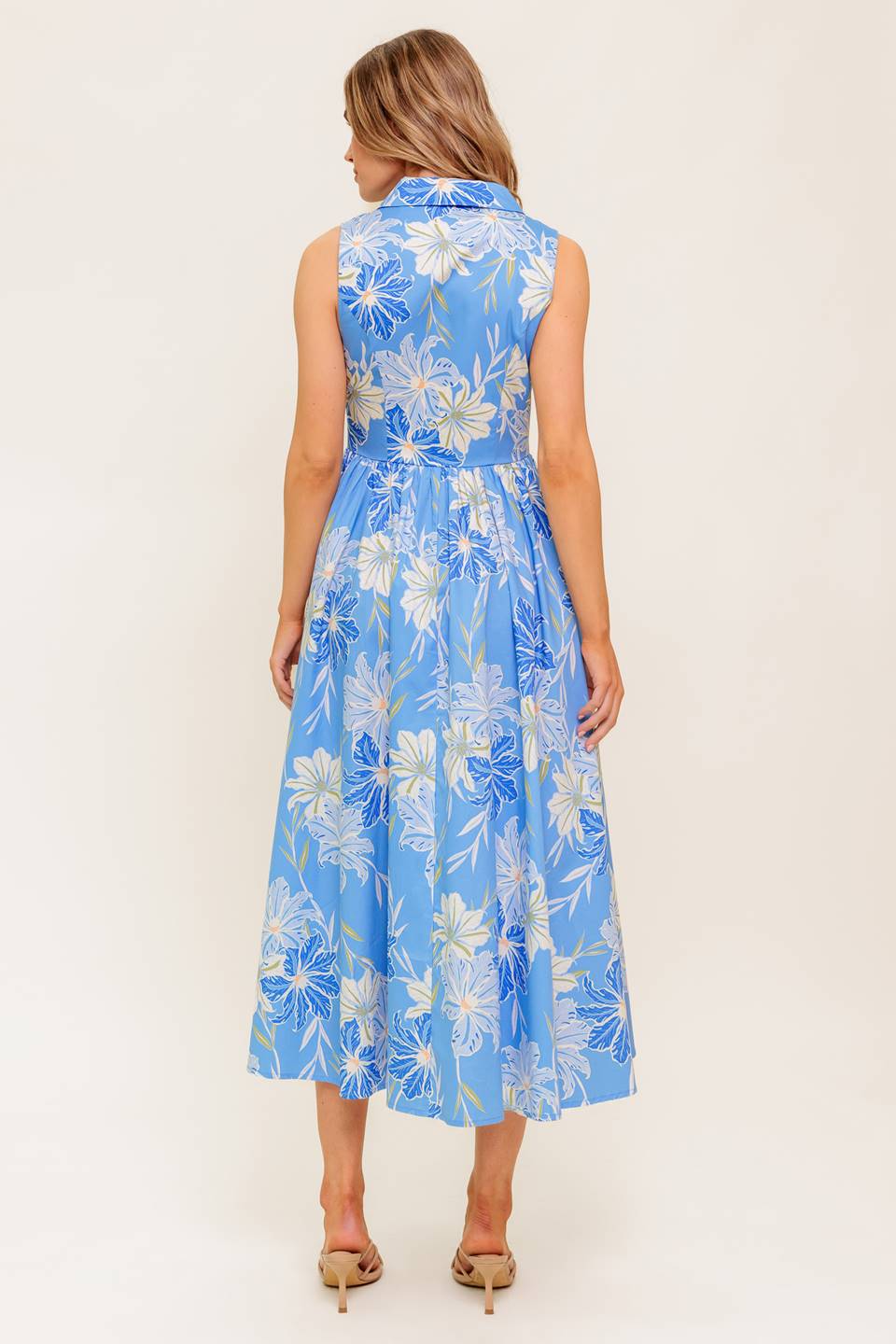 A printed woven midi dress featuring collar, sleeveless, basque waistline and button down closure.