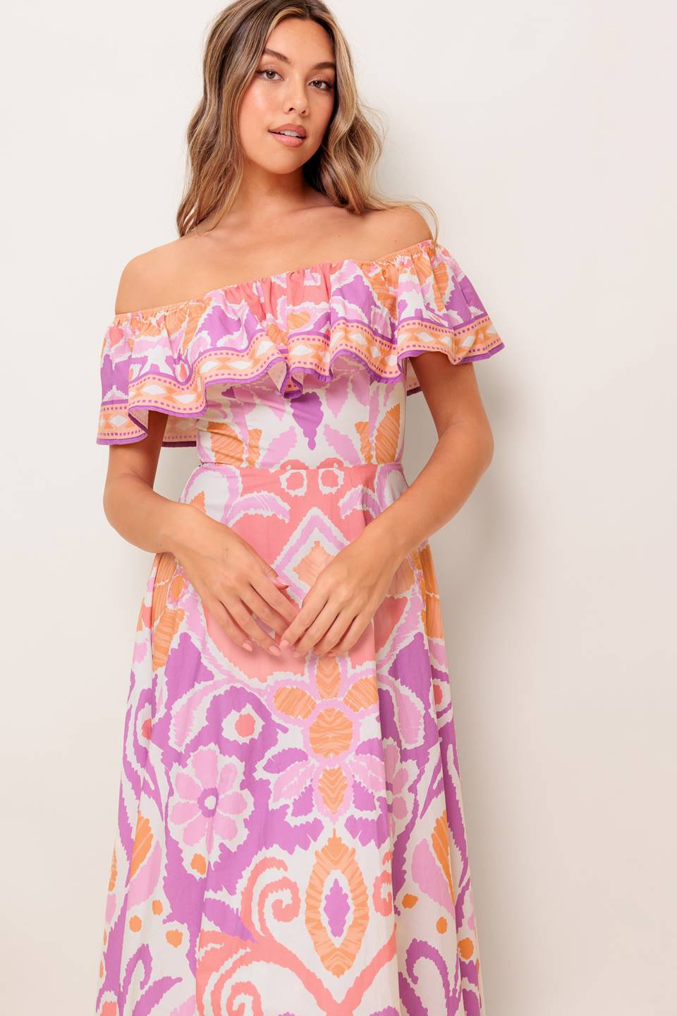 A printed woven midi dress featuring off shoulder neckline, flounce, circle skirt and back zipper closure
