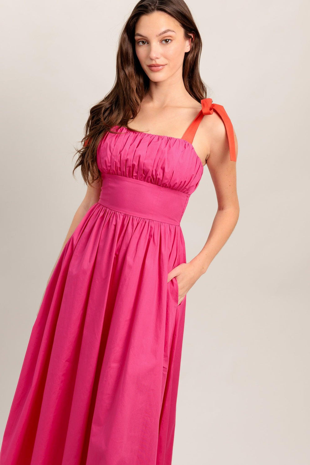 A solid fuchsia woven midi dress featuring straight neckline, red self-tie straps, shirred bodice, full skirt and smocked back bodice and zipper closure

Details:

Self : 100% Cotton
Contrast : 100% Cotton
Lining : 100% Cotton

Size &amp; Fit

- Model is 5`8" And Wearing Size Small
- Measurements Taken From Size Small
- Approx. Length: 51"