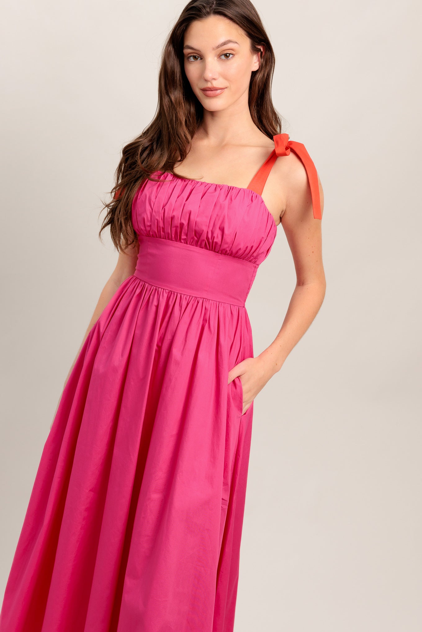 A solid fuchsia woven midi dress featuring straight neckline, red self-tie straps, shirred bodice, full skirt and smocked back bodice and zipper closure

Details:

Self : 100% Cotton
Contrast : 100% Cotton
Lining : 100% Cotton

Size &amp; Fit

- Model is 5`8" And Wearing Size Small
- Measurements Taken From Size Small
- Approx. Length: 51"