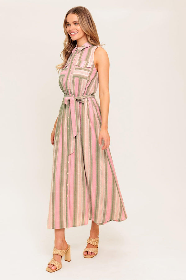 A striped woven midi dress featuring collar, button down, pockets, elasticized waist, self sash and full skirt.