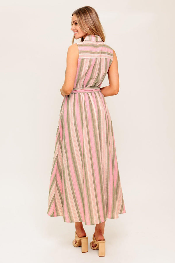 A striped woven midi dress featuring collar, button down, pockets, elasticized waist, self sash and full skirt.