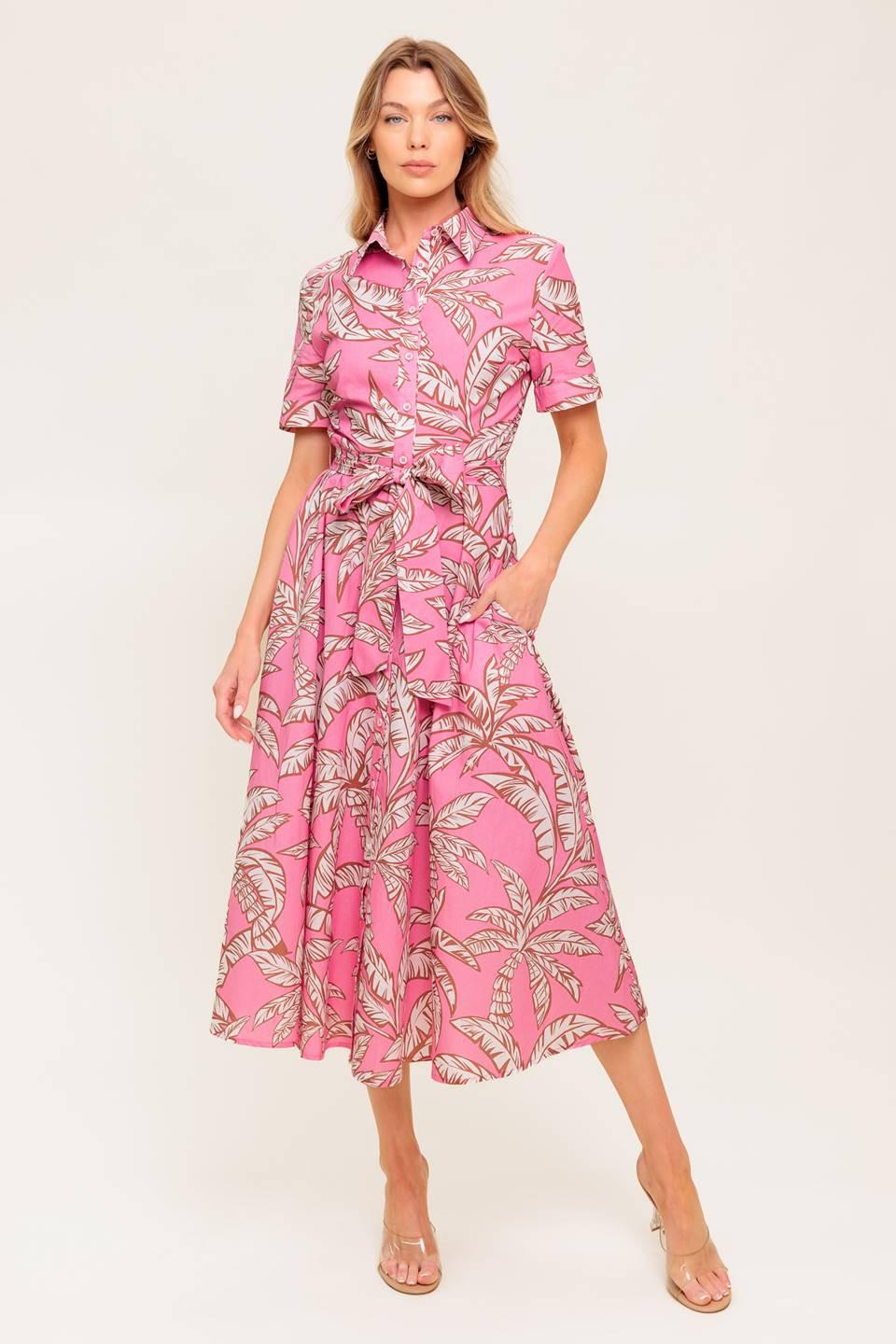 A printed woven midi dress featuring collar, short cuffed sleeve, front button down, self sash tie and full skirt.