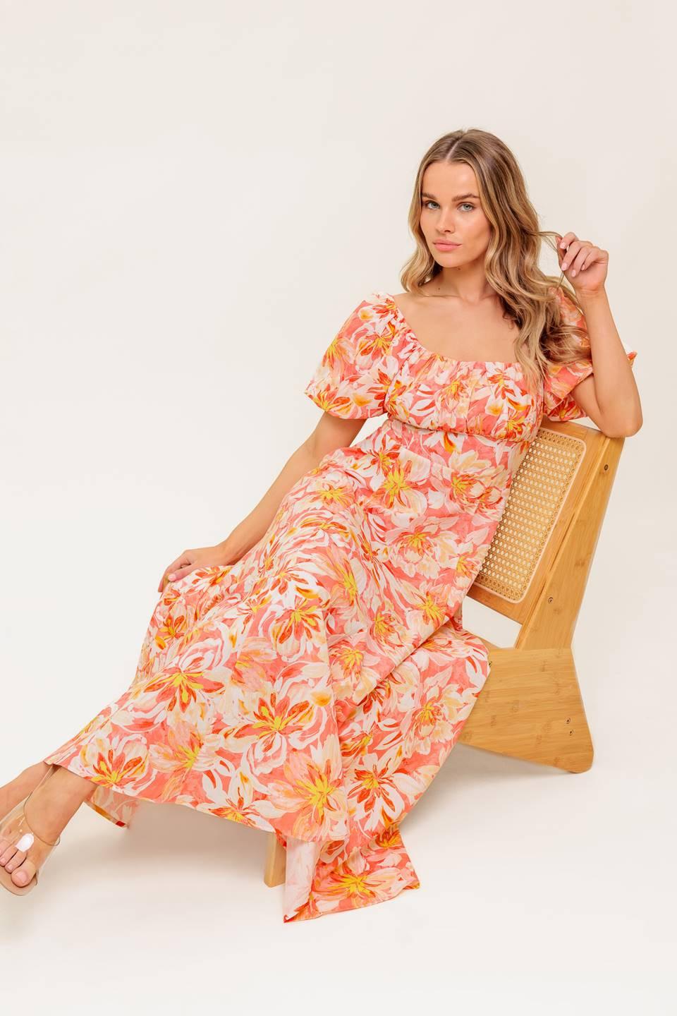 A printed woven midi dress featuring square neckline, short puff sleeve, shirred bodice, circle skirt and back zipper closure