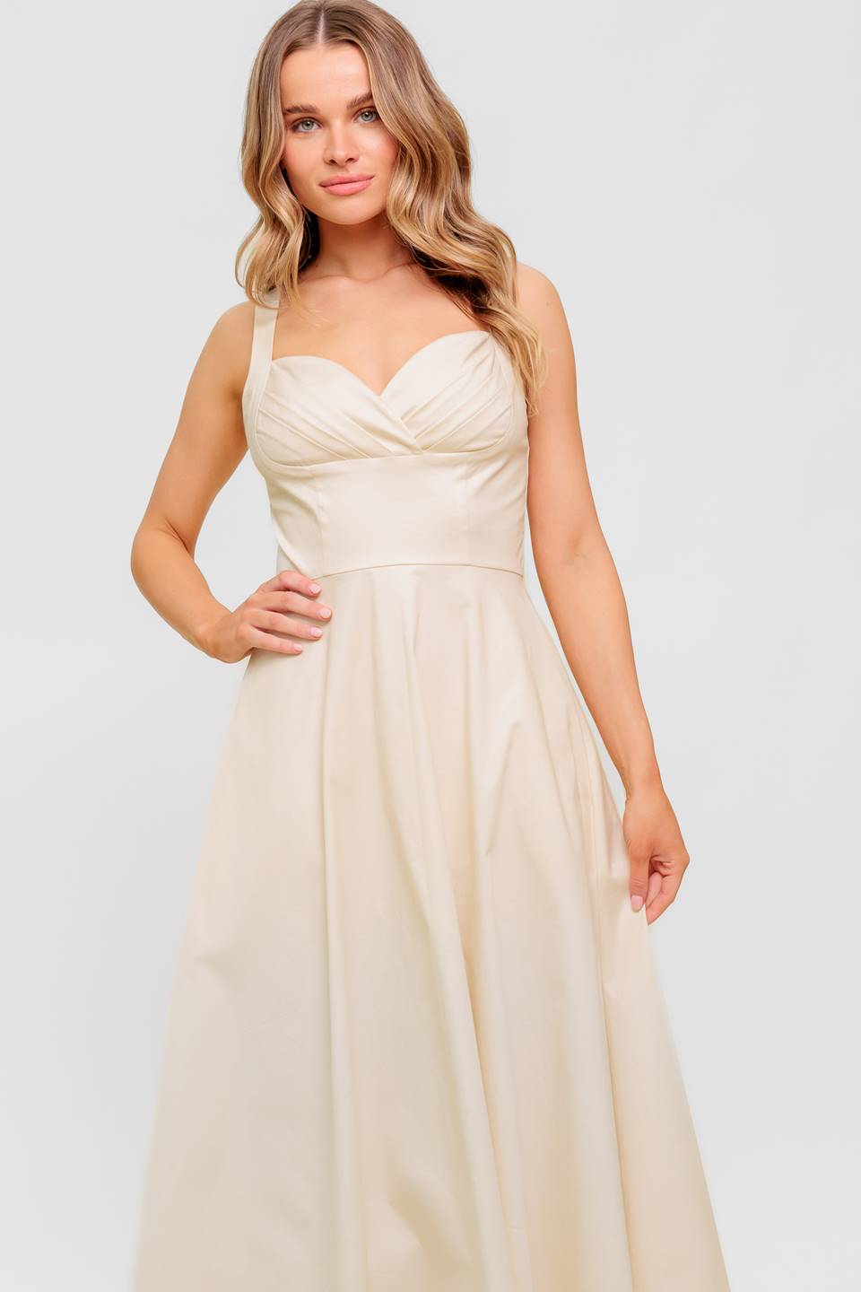A printed woven midi dress featuring strapless, shirred bodice, full skirt and smock and zipper back closure.
