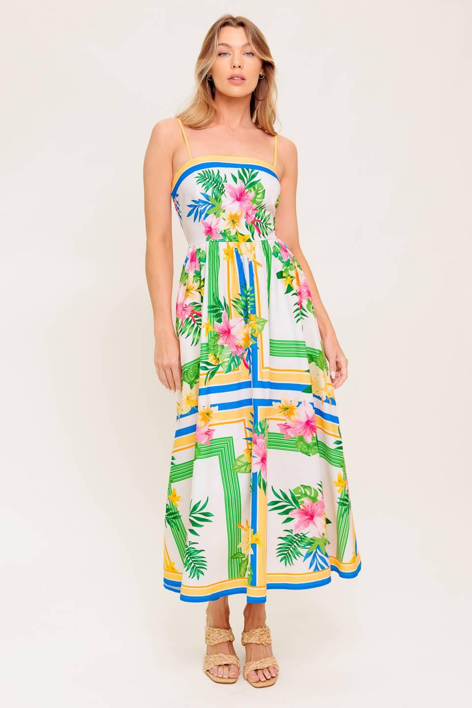 A printed woven midi dress featuring straight neckline, straps, full skirt and smocked back bodice.