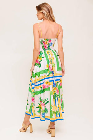 A printed woven midi dress featuring straight neckline, straps, full skirt and smocked back bodice.
